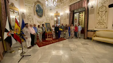 Foto de familia con el cartel